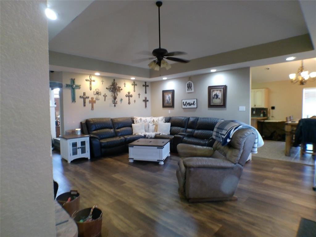 200 County Road 3170 Decatur, TX 76234 - Photo 24 of 31 a living room with furniture a window and a chandelier