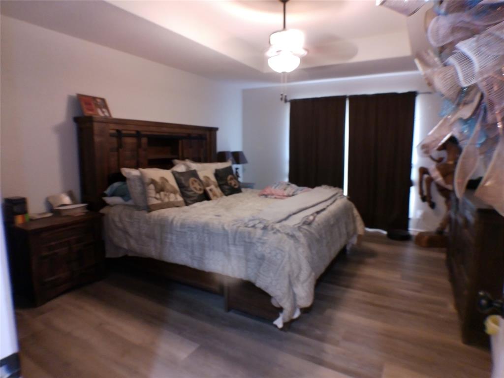 200 County Road 3170 Decatur, TX 76234 - Photo 8 of 31 a bedroom with bed and wooden floor