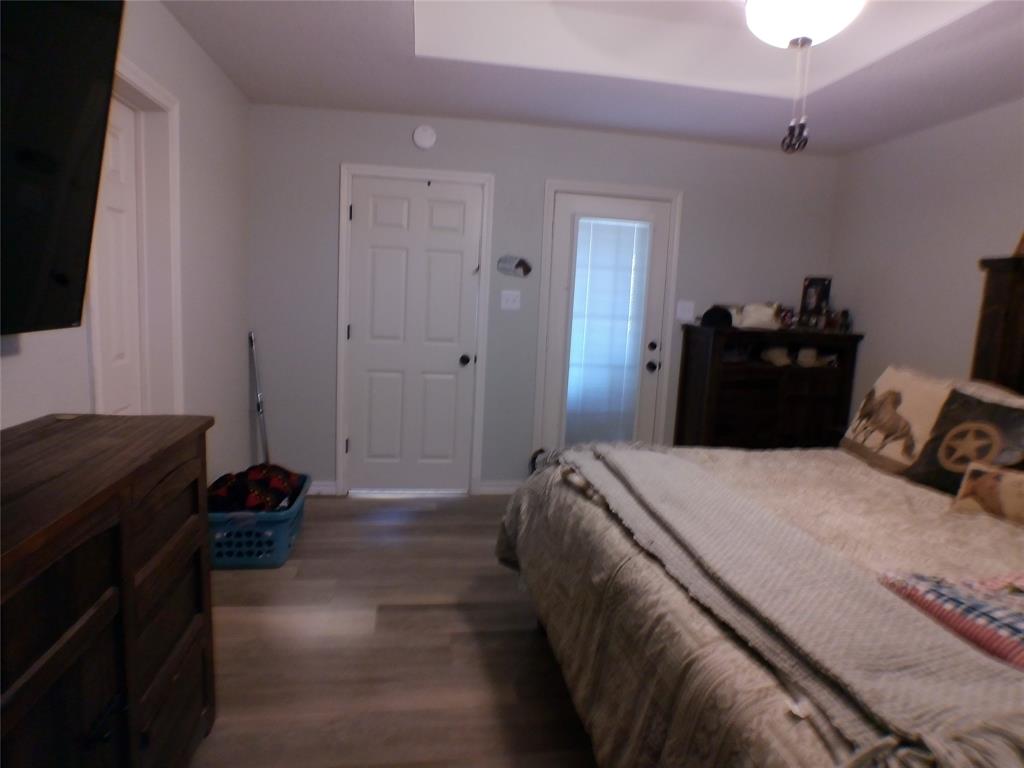 200 County Road 3170 Decatur, TX 76234 - Photo 9 of 31 a bed room with a bed and a television