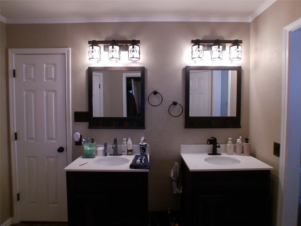 200 County Road 3170 Decatur, TX 76234 - Photo 10 of 31 a bathroom with a sink vanity and a mirror