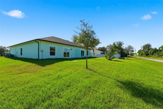 a house view with a backyard space