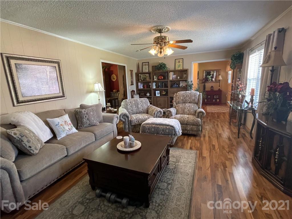 180 Watergate Drive Alexis, NC 28006 - Photo 14 of 40 a living room with furniture and wooden floor