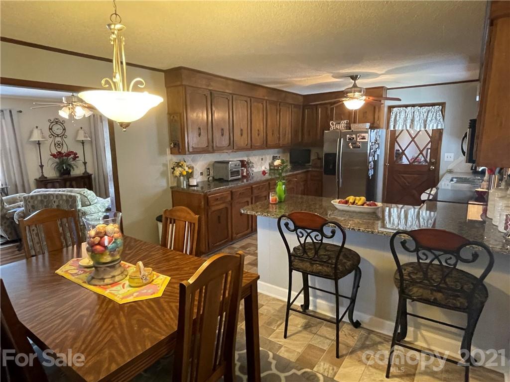 180 Watergate Drive Alexis, NC 28006 - Photo 17 of 40 a view of a dining room with furniture