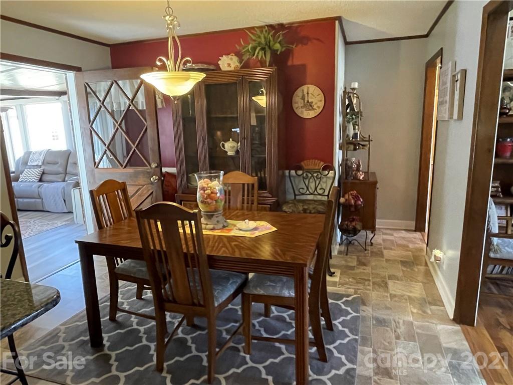 180 Watergate Drive Alexis, NC 28006 - Photo 18 of 40 a view of a dining room with furniture and chandelier