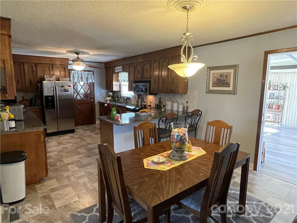 180 Watergate Drive Alexis, NC 28006 - Photo 19 of 40 a view of a dining room with furniture