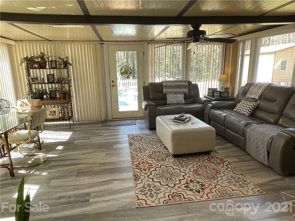 180 Watergate Drive Alexis, NC 28006 - Photo 24 of 40 a living room with furniture and a large window