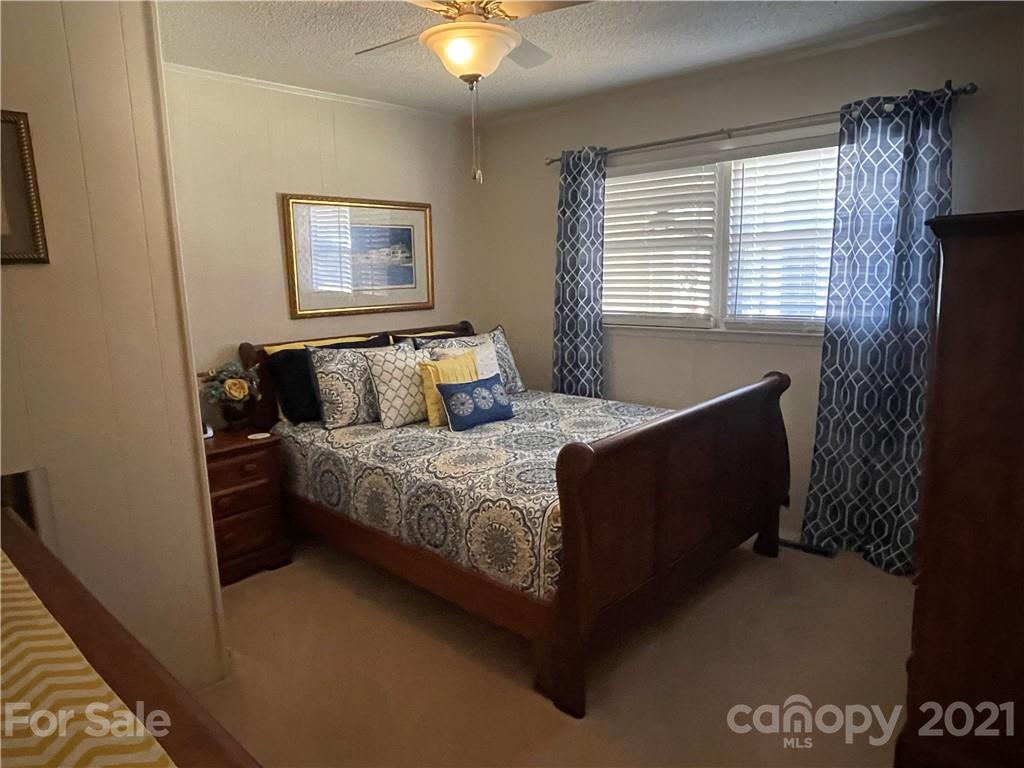 180 Watergate Drive Alexis, NC 28006 - Photo 32 of 40 a bedroom with a bed and a window