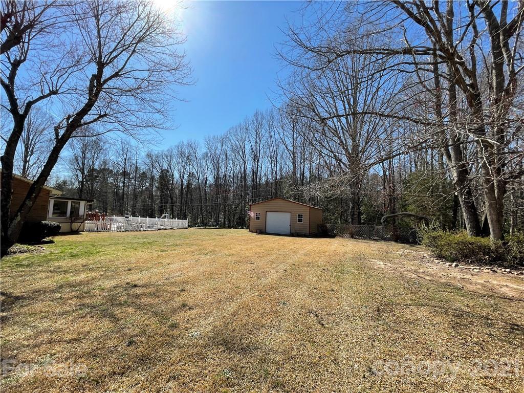 180 Watergate Drive Alexis, NC 28006 - Photo 8 of 40 a yard with a tree