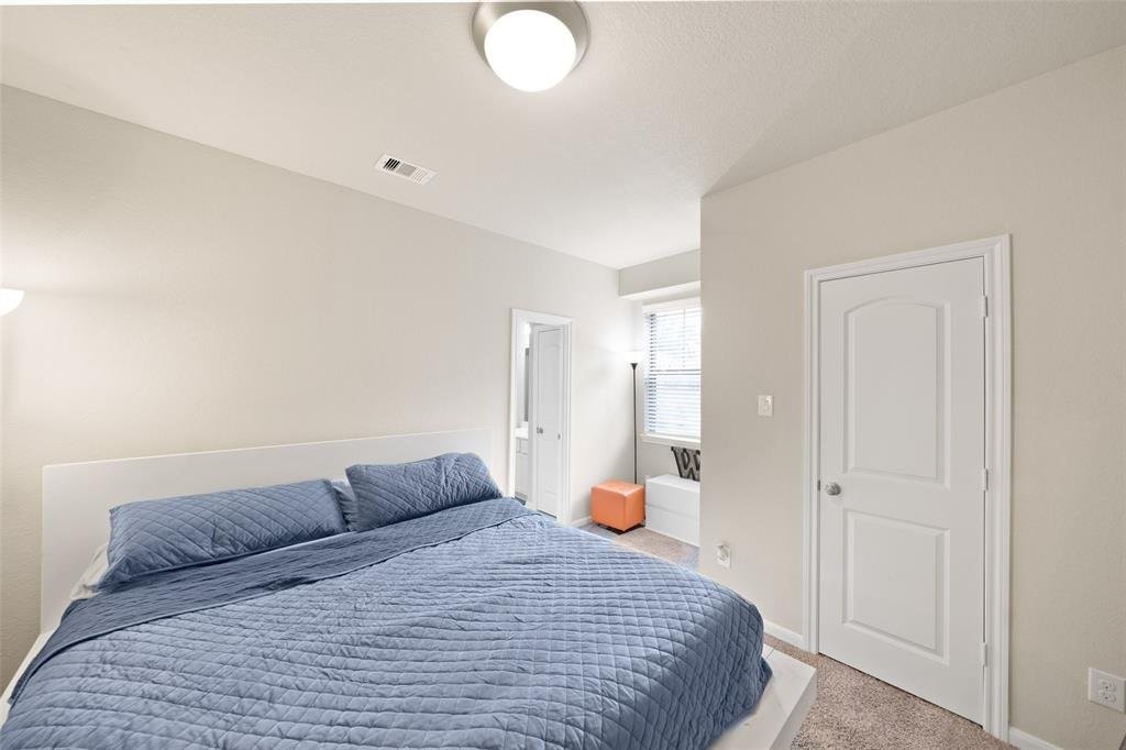 4241 Merry Mill Drive Spring, TX 77386 - Photo 15 of 24 a bedroom with a bed and window
