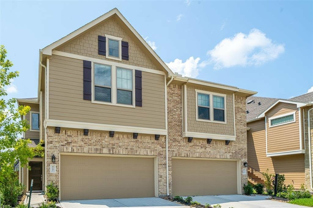 4241 Merry Mill Drive Spring, TX 77386 - Photo 2 of 24 a front view of a house with a yard and garage