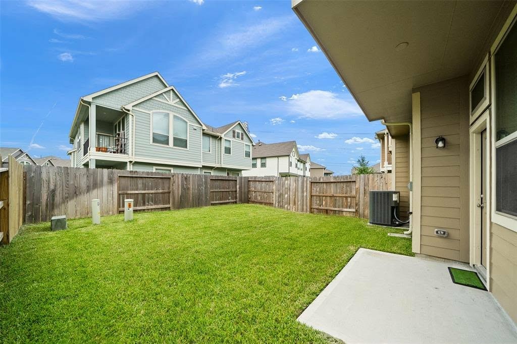 4241 Merry Mill Drive Spring, TX 77386 - Photo 23 of 24 a view of a house with a yard and deck