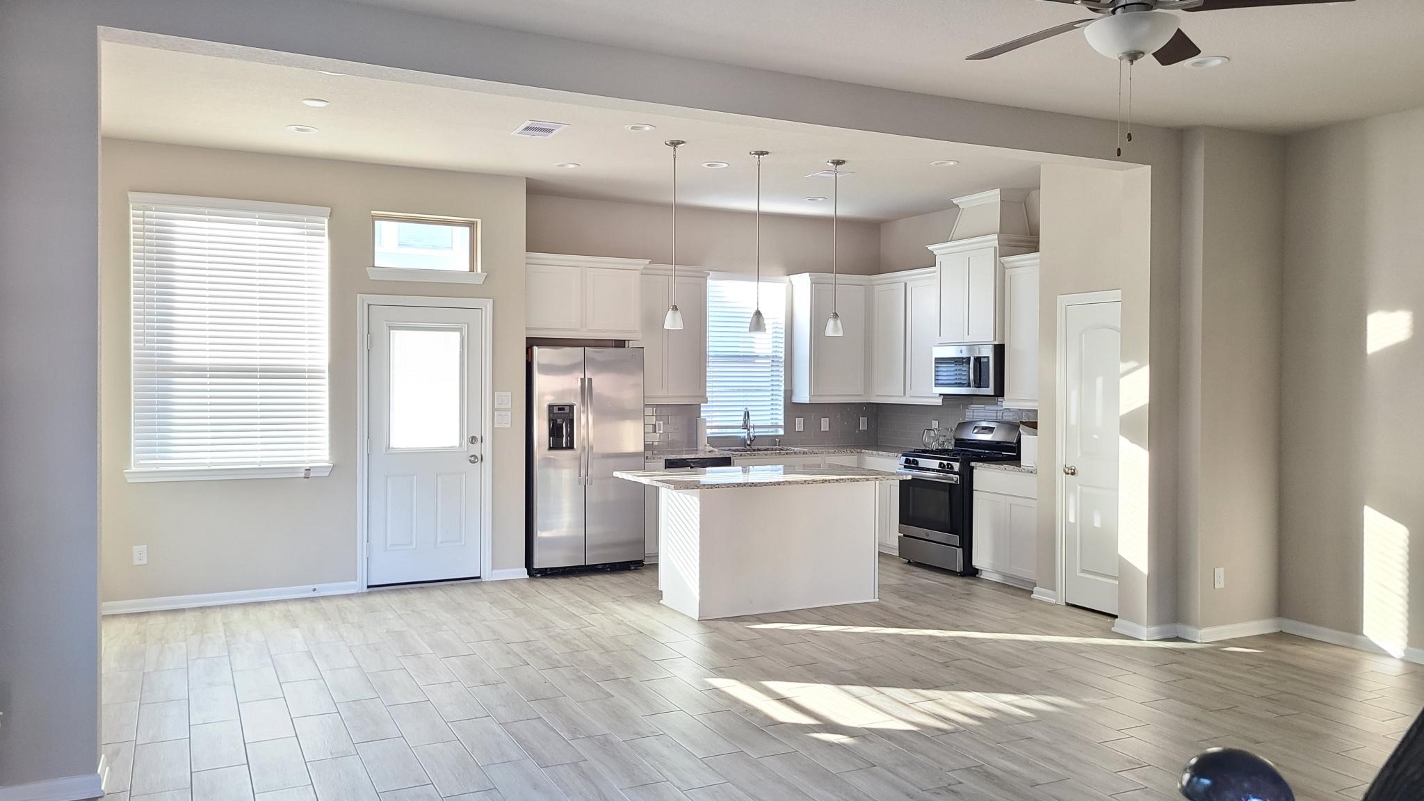 4241 Merry Mill Drive Spring, TX 77386 - Photo 5 of 24 a kitchen with a refrigerator and a sink