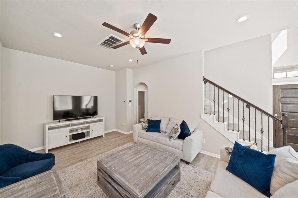 4241 Merry Mill Drive Spring, TX 77386 - Photo 6 of 24 a living room with furniture and a flat screen tv