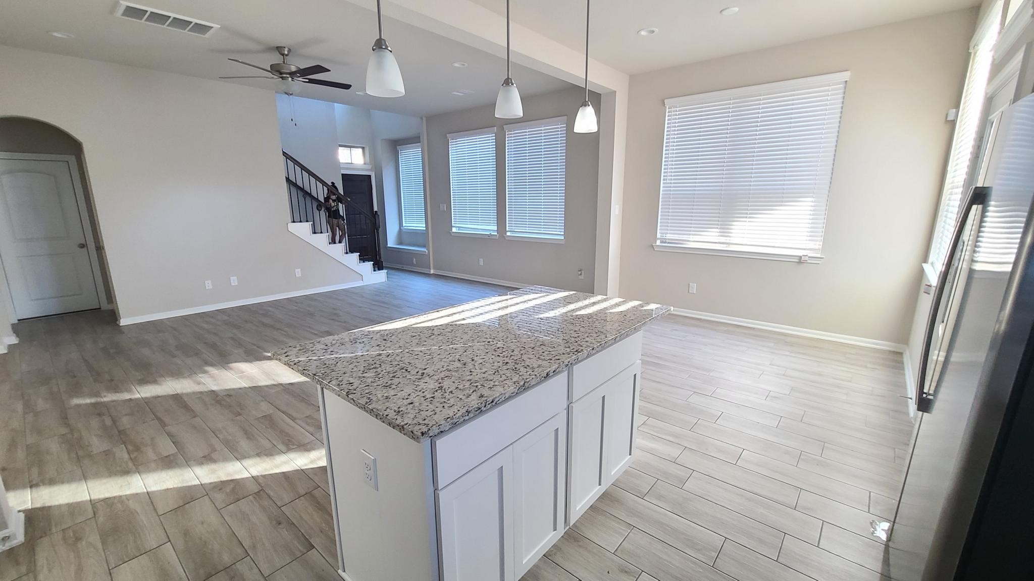 4241 Merry Mill Drive Spring, TX 77386 - Photo 9 of 24 a bathroom with a granite countertop sink a toilet and a large mirror