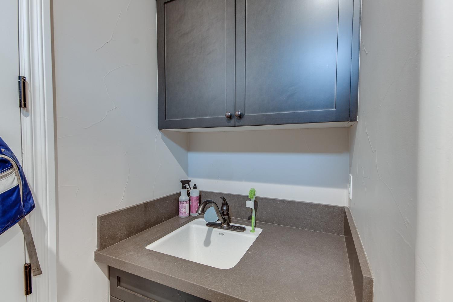 1437 Jordan Avenue Clovis, CA 93611 - Photo 20 of 53 a bathroom with a sink and a mirror