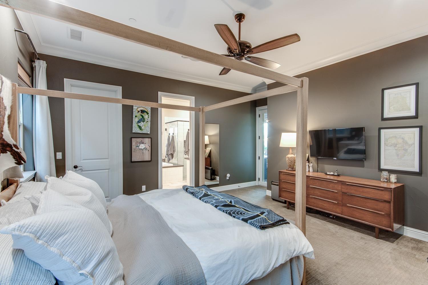 1437 Jordan Avenue Clovis, CA 93611 - Photo 25 of 53 a bedroom with a bed and a flat screen tv
