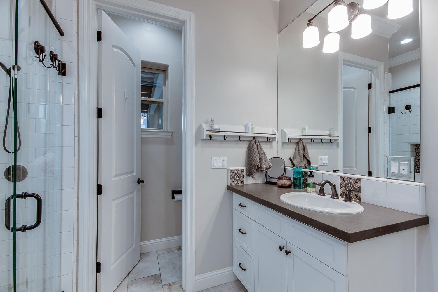 1437 Jordan Avenue Clovis, CA 93611 - Photo 28 of 53 a bathroom with a sink double vanity and shower