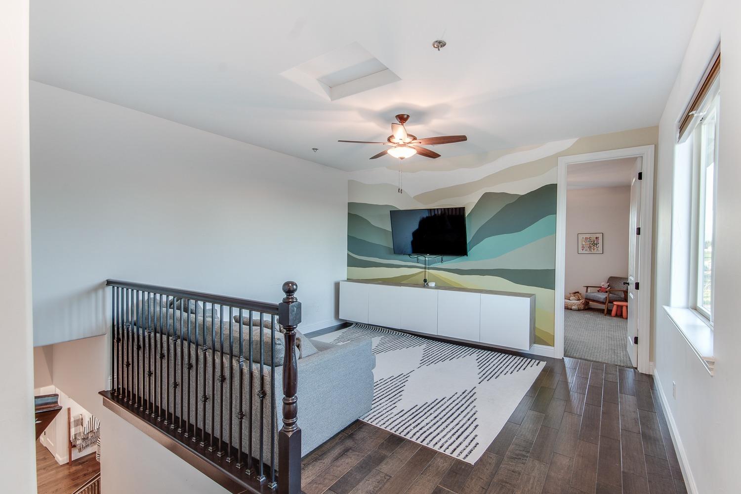 1437 Jordan Avenue Clovis, CA 93611 - Photo 29 of 53 a living room with furniture and a flat screen tv