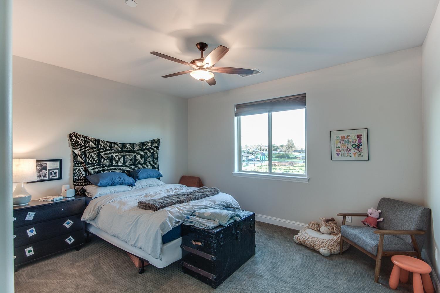 1437 Jordan Avenue Clovis, CA 93611 - Photo 30 of 53 a bedroom with a bed and a window