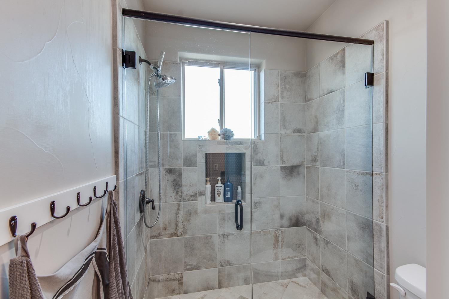 1437 Jordan Avenue Clovis, CA 93611 - Photo 34 of 53 a bathroom with a shower