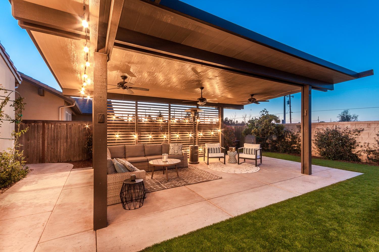 1437 Jordan Avenue Clovis, CA 93611 - Photo 40 of 53 a view of a patio with a table and chairs under an umbrella