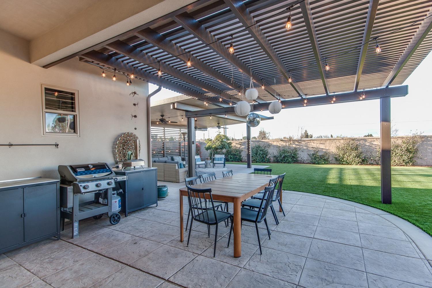 1437 Jordan Avenue Clovis, CA 93611 - Photo 42 of 53 a view of a patio with a table and chairs