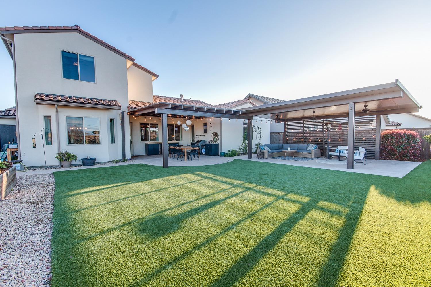 1437 Jordan Avenue Clovis, CA 93611 - Photo 50 of 53 a view of house with a big yard and potted plants