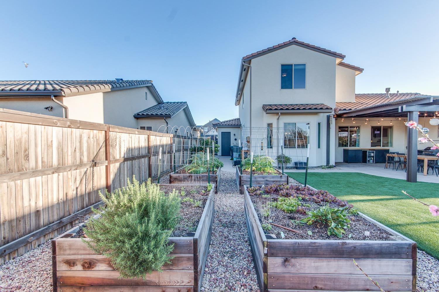 1437 Jordan Avenue Clovis, CA 93611 - Photo 51 of 53 a front view of a house with a yard and seating space
