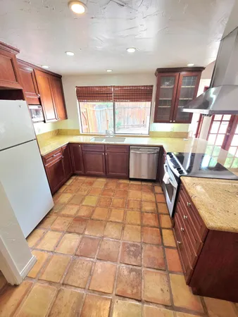 a living room with a couch and a stove top oven