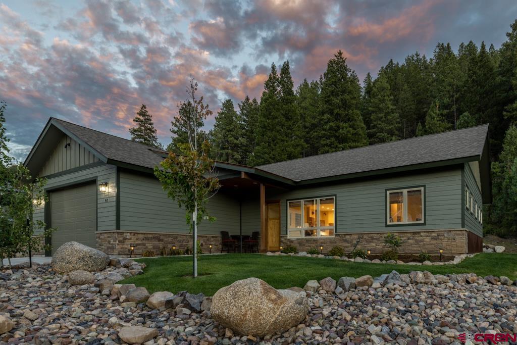 62 Manitou Lane Durango, CO 81301 - Photo 1 of 34 a view of a house with a yard and large tree