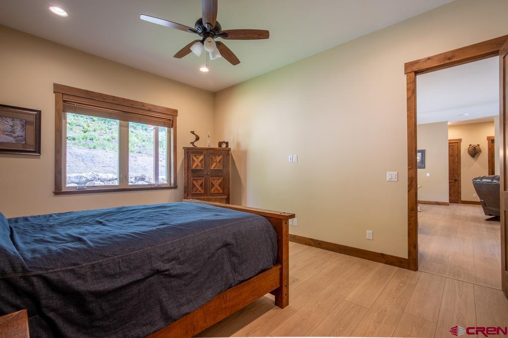 62 Manitou Lane Durango, CO 81301 - Photo 14 of 34 a bedroom with a bed and a window