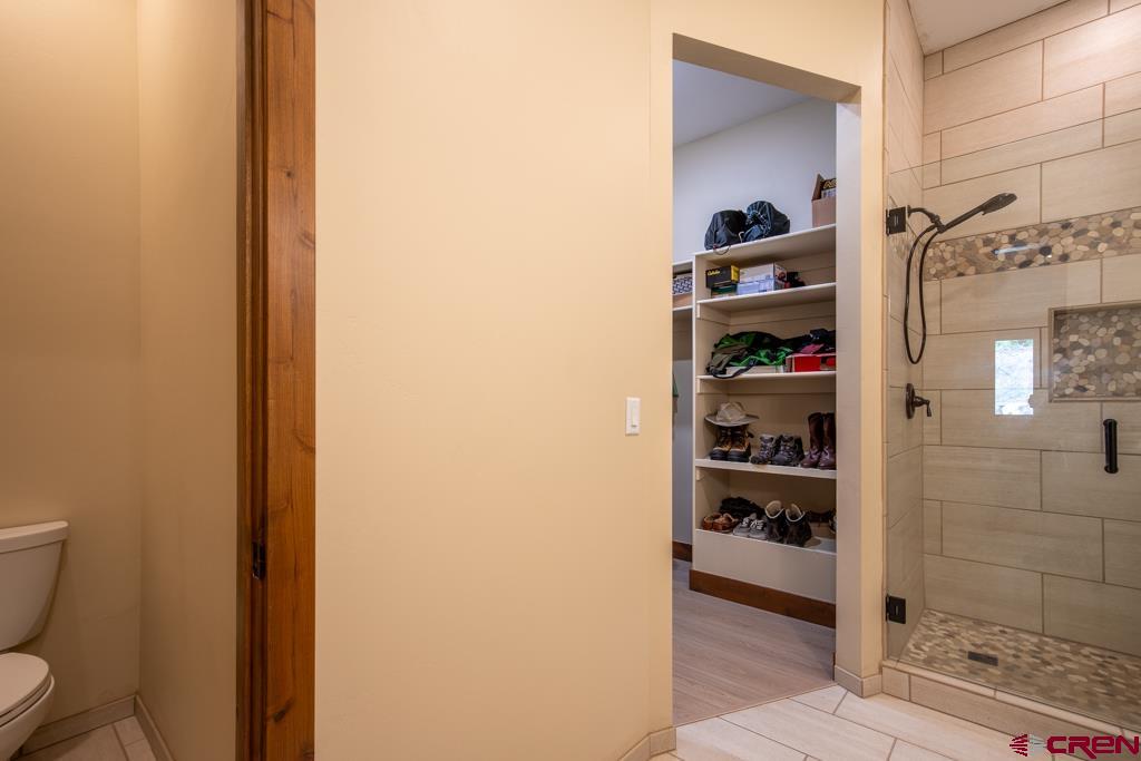 62 Manitou Lane Durango, CO 81301 - Photo 15 of 34 a bathroom with a toilet and a shower