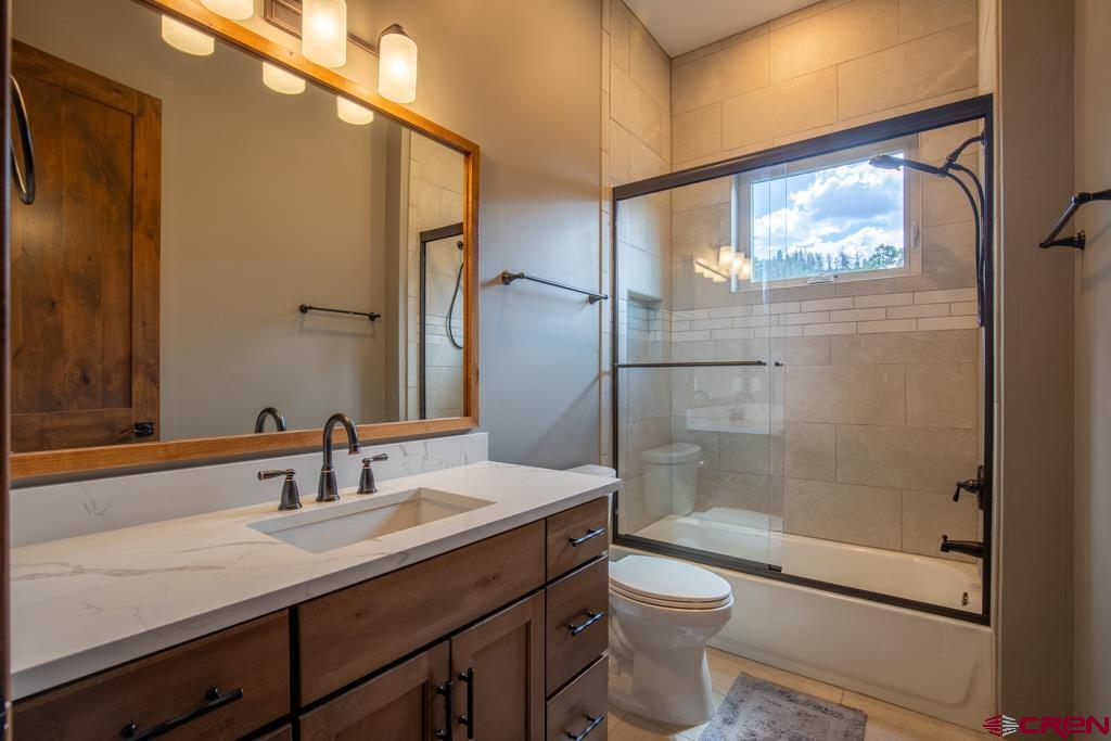62 Manitou Lane Durango, CO 81301 - Photo 22 of 34 a bathroom with a sink a toilet and shower