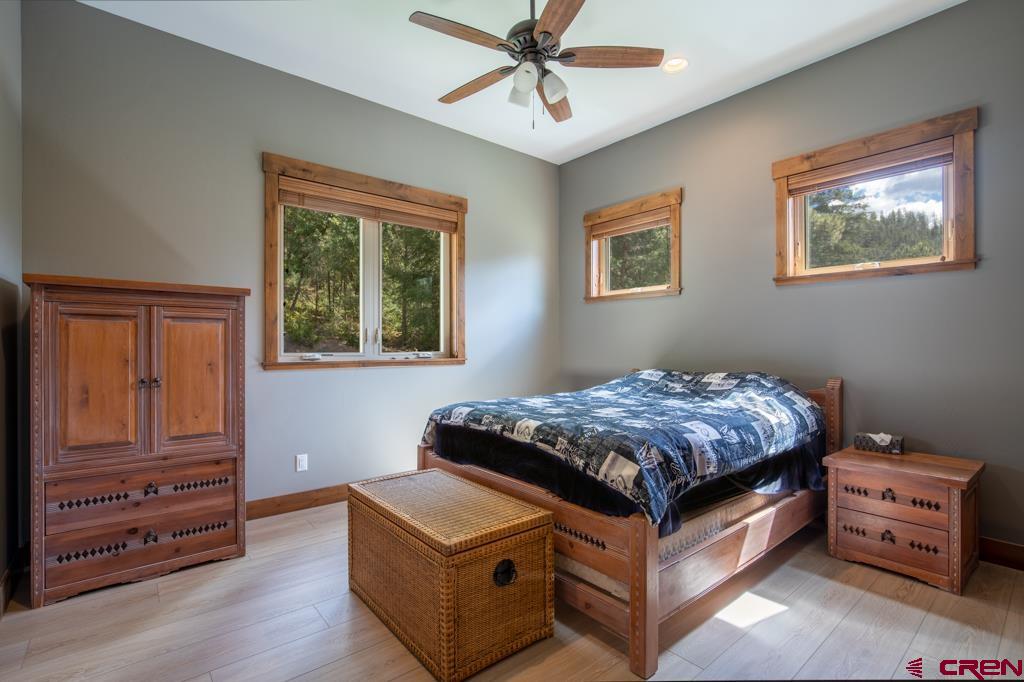 62 Manitou Lane Durango, CO 81301 - Photo 24 of 34 a bed room with a bed and a window