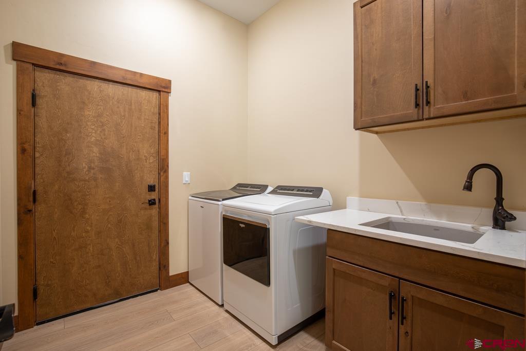62 Manitou Lane Durango, CO 81301 - Photo 27 of 34 a utility room with sink dryer and washer