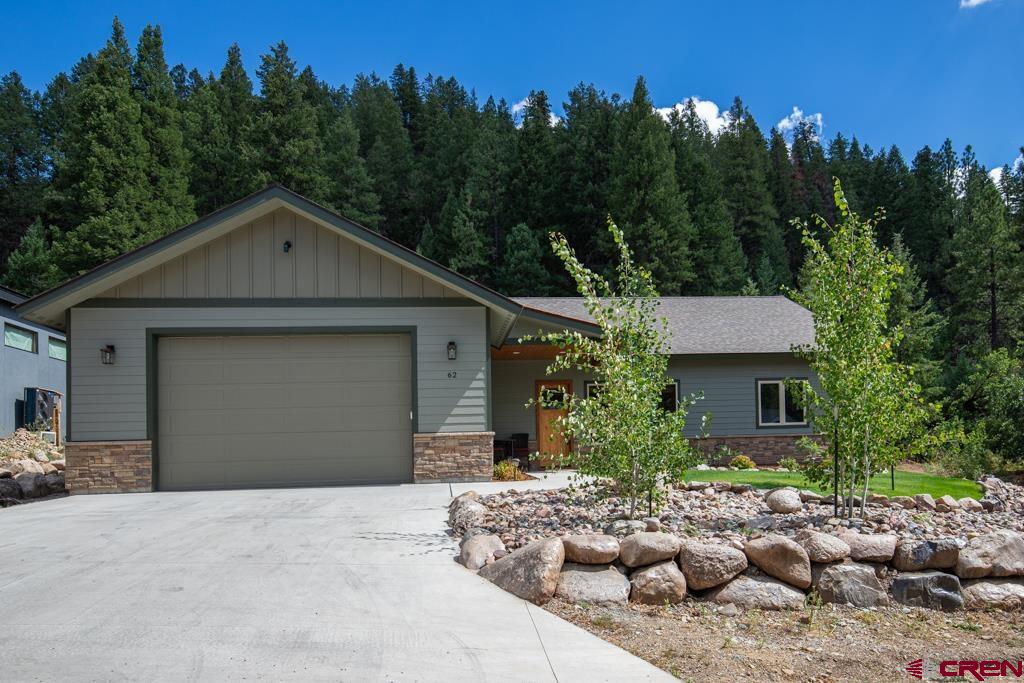 62 Manitou Lane Durango, CO 81301 - Photo 29 of 34 a front view of a house with a yard garage and outdoor seating
