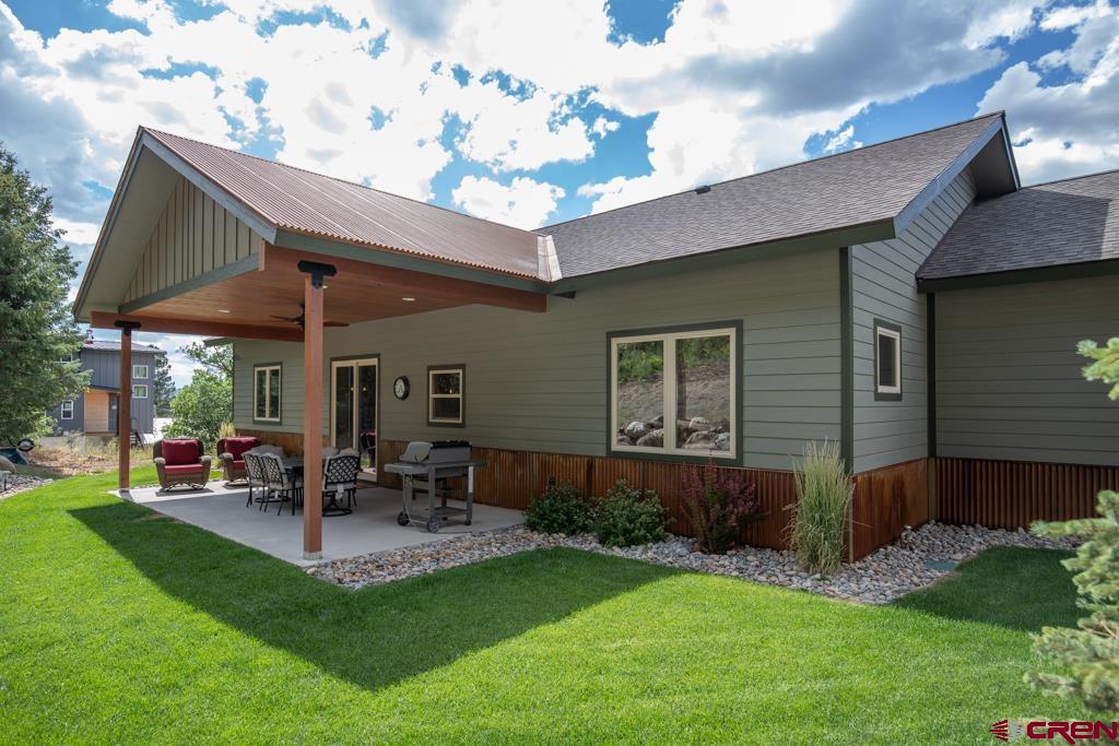 62 Manitou Lane Durango, CO 81301 - Photo 30 of 34 a patio with a table and chairs and potted plants