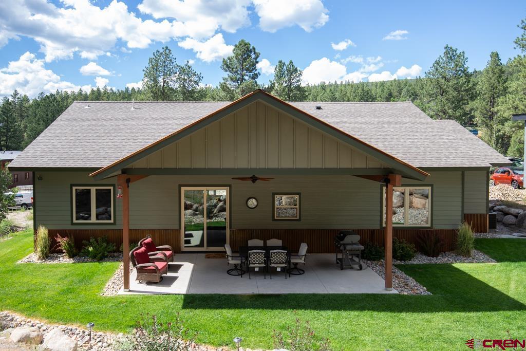 62 Manitou Lane Durango, CO 81301 - Photo 32 of 34 a backyard of a house with table and chairs