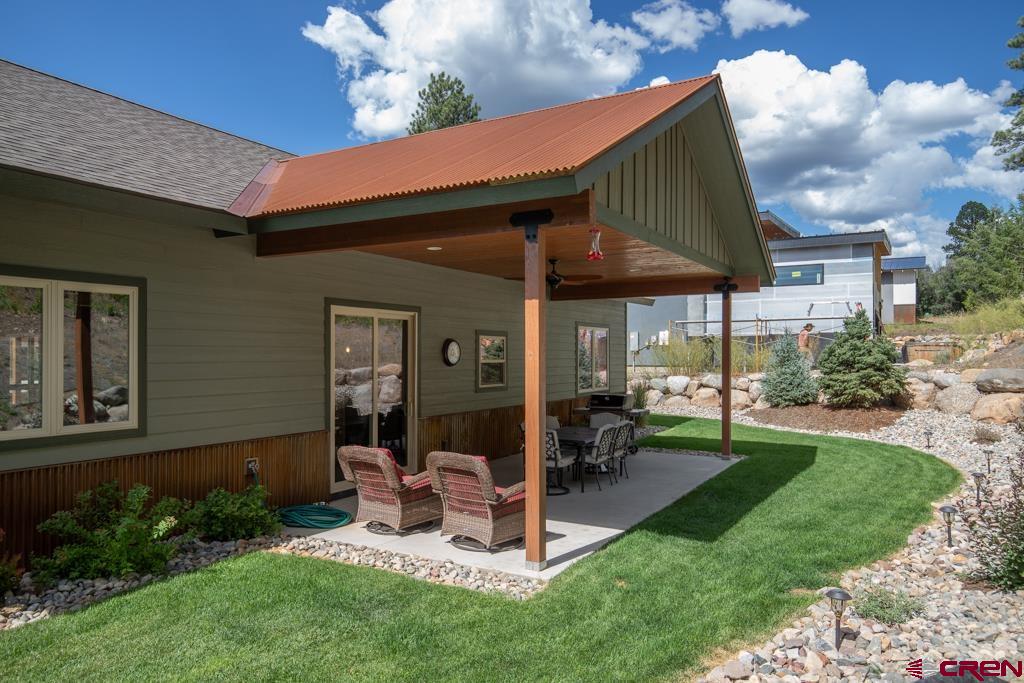 62 Manitou Lane Durango, CO 81301 - Photo 33 of 34 a view of a chair and table in backyard of the house