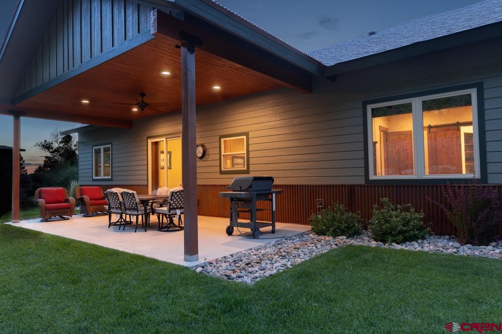 62 Manitou Lane Durango, CO 81301 - Photo 5 of 34 a view of a porch with chairs and backyard