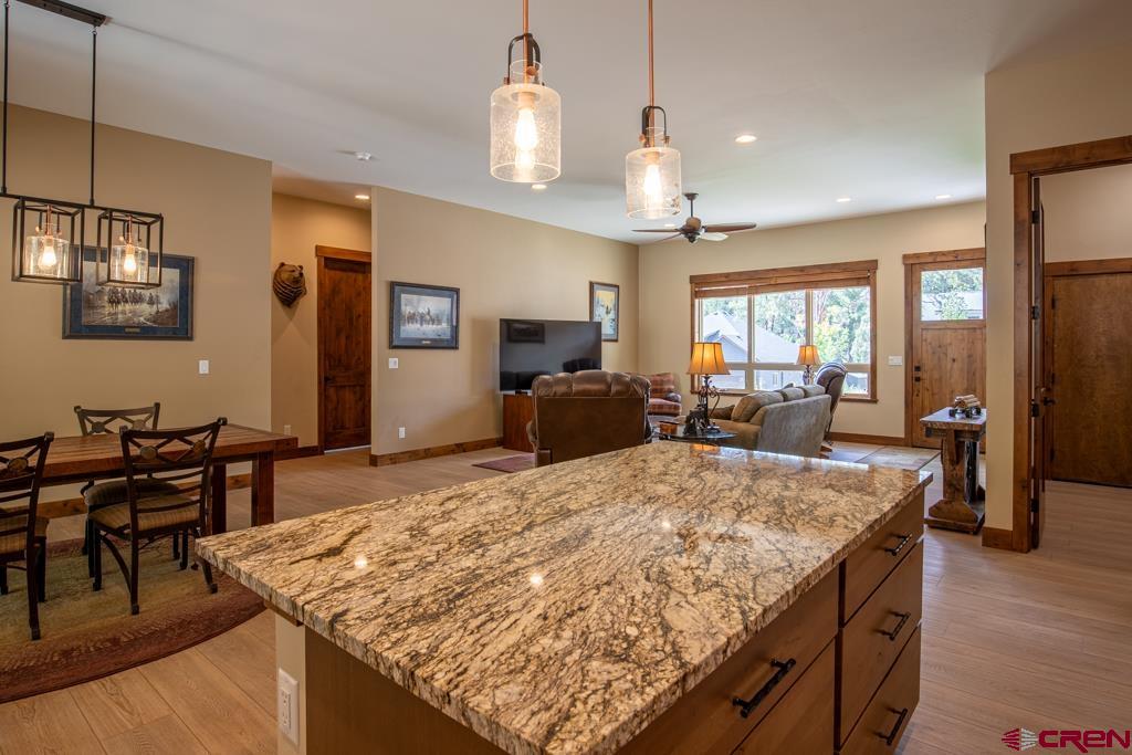 62 Manitou Lane Durango, CO 81301 - Photo 6 of 34 a large kitchen with kitchen island a sink table and chairs