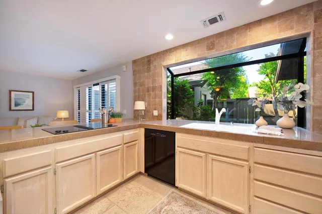 a kitchen with a sink and cabinets