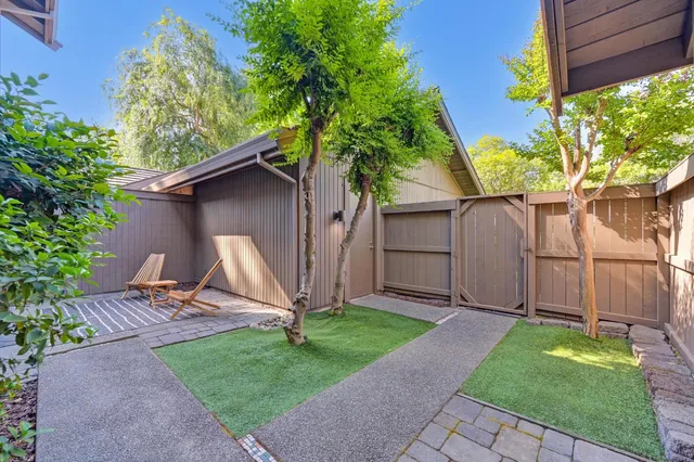 a view of backyard with a barn and a cactus plant