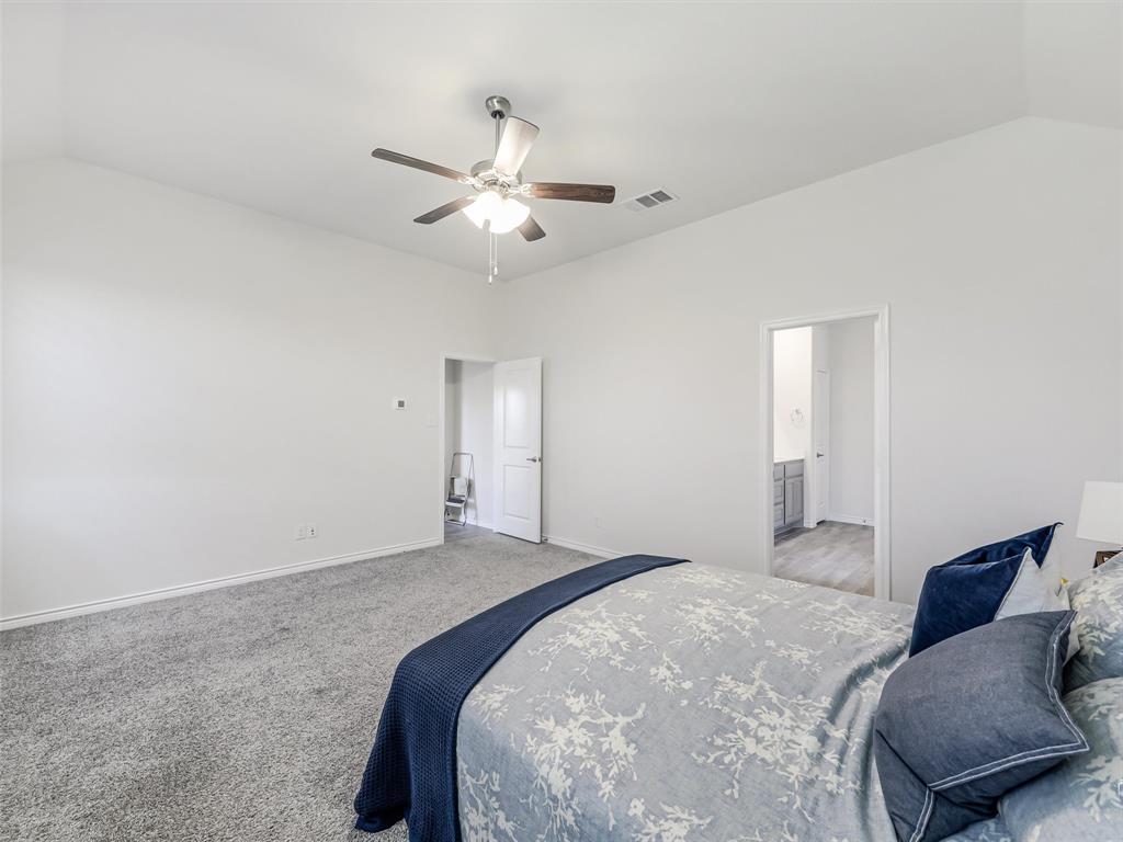 3024 Meredith Lane Forney, TX 75126 - Photo 12 of 29 Vaulted ceilings with a ceiling fan, light gray carpeting, and white painted walls