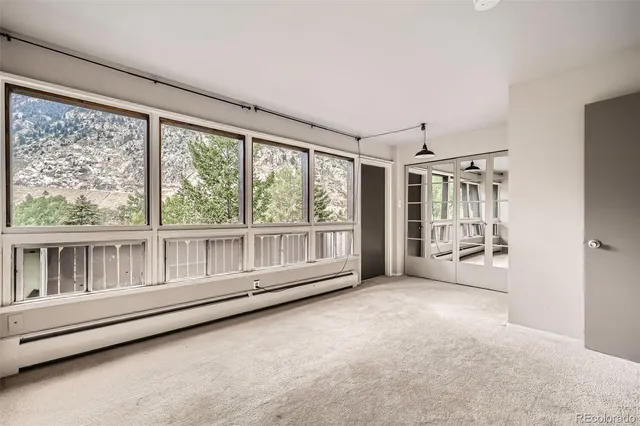a view of an empty room with a window