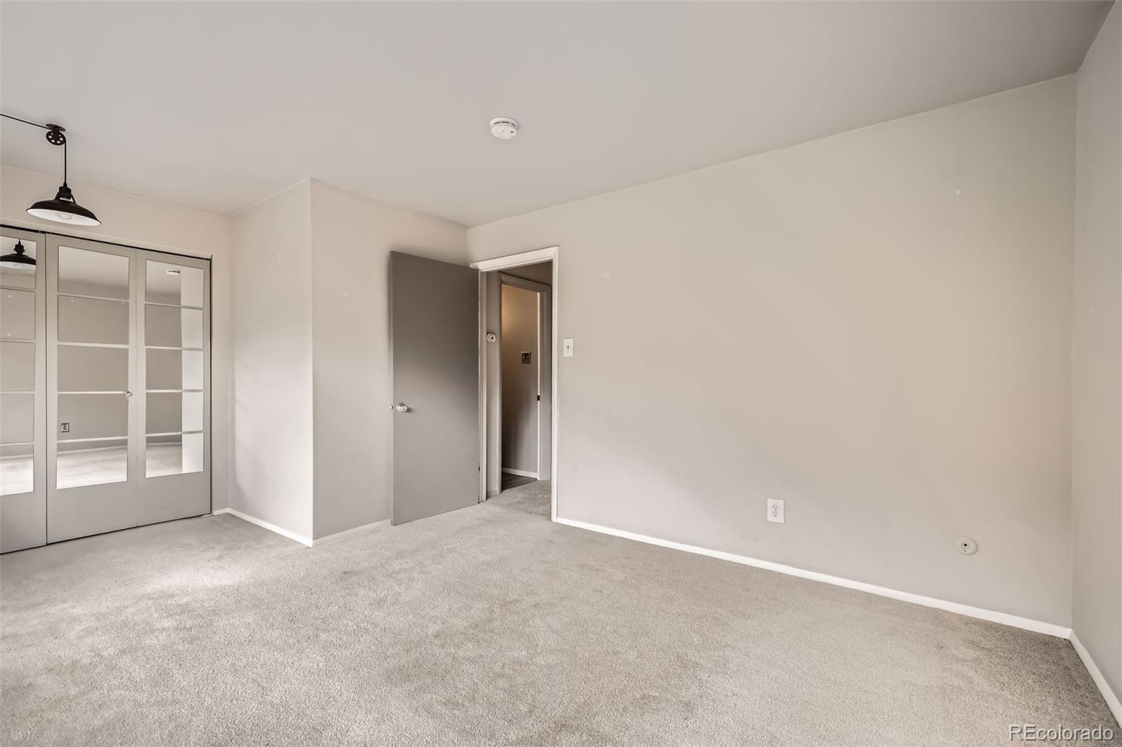 817 Valley View Drive Georgetown, CO 80444 - Photo 19 of 30 an empty room with windows and closet
