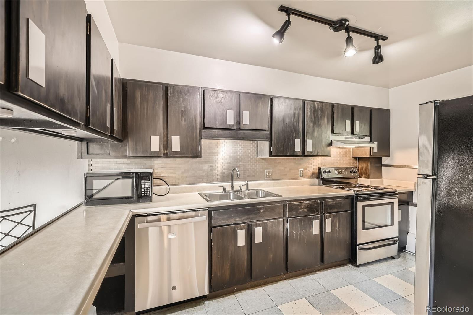 817 Valley View Drive Georgetown, CO 80444 - Photo 8 of 30 a kitchen with stainless steel appliances granite countertop a sink stove and refrigerator