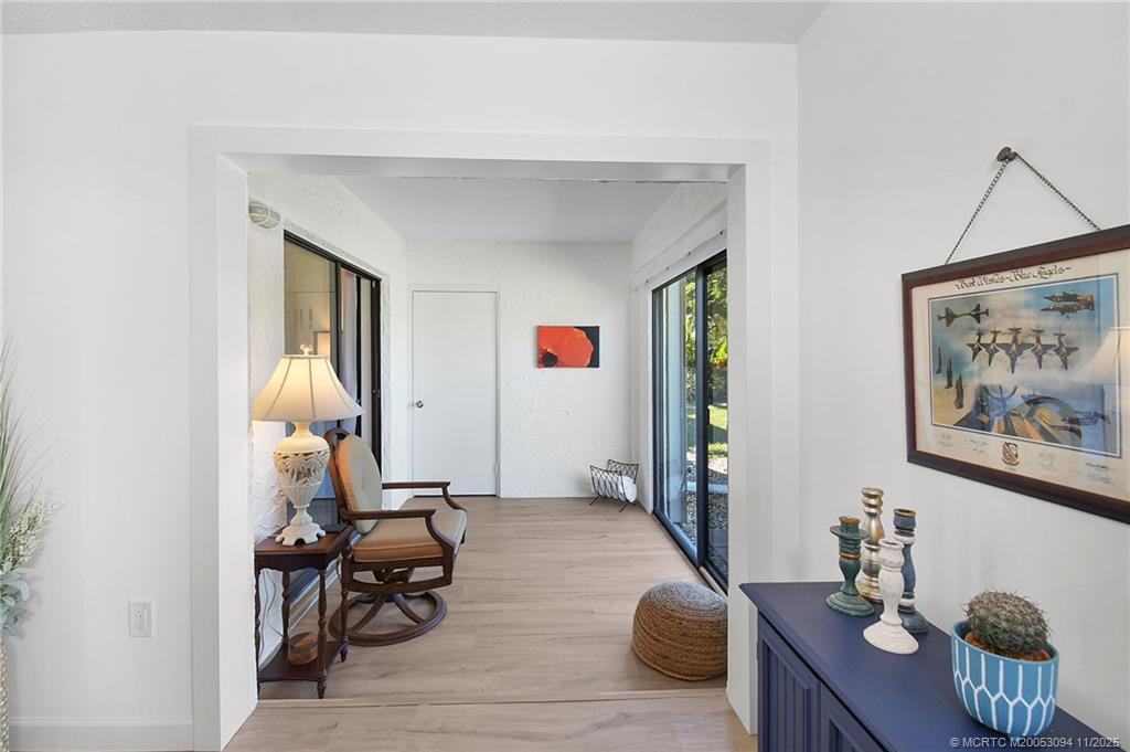 5111 Southeast Miles Grant Road, Unit 103 Stuart, FL 34997 - Photo 16 of 59 a living room with furniture and a window