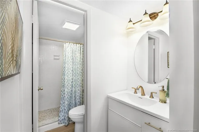 a view of a big house with swimming pool lawn chairs and a yard