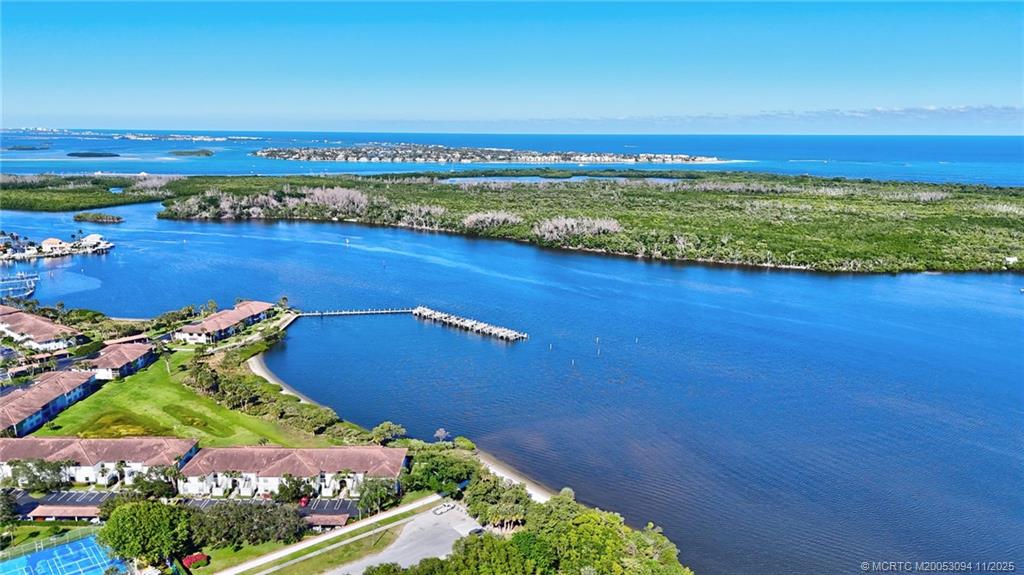 5111 Southeast Miles Grant Road, Unit 103 Stuart, FL 34997 - Photo 37 of 59 a view of a city with an ocean